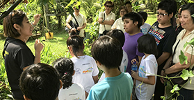 Fun in the sun with needy kids at veggie farm